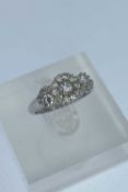 PLATINUM DIAMOND CLUSTER RING, set with nineteen graduated stones, ring size L, 4.8gms Provenance: