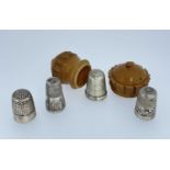 VEGETABLE IVORY THIMBLE CASE, together with four white metal thimbles, two hallmarked silver (5)