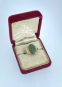 YELLOW GOLD RING, set with cabochon green gemstone, possibly chrysoprase, stamped '14k', ring size