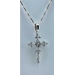 WHITE METAL DIAMOND SET CROSS PENDANT, on 18ct white gold twisted box link chain stamped '750', 3.