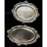 PAIR GEORGE III SILVER DISHES, William Burwash, London 1819, of rococo form, with C-scroll and