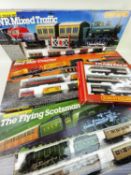 FOUR HORNBY OO GAUGE TRAIN SETS, including R778 'Flying Scotsman' set with 4 additional coaches;