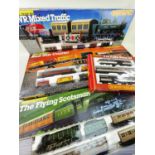 FOUR HORNBY OO GAUGE TRAIN SETS, including R778 'Flying Scotsman' set with 4 additional coaches;