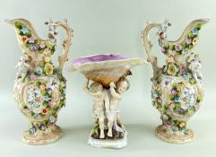 CONTINENTAL PORCELAIN FIGURAL SHELL CENTREPIECE & PAIR EWERS, latter encrusted with flowers and
