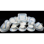WEDGWOOD 'QUEENSWARE' BLUE & WHITE MOULDED PART TEA SET, comprising twelve cups, seven circular