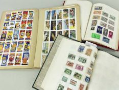 STAMPS & CARDS comprising green album of all world stamps, red album of African stamps and a book of