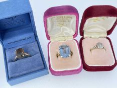 THREE BOXED GOLD RINGS comprising 9ct gold smoky quartz ring, 9ct gold believed aquamarine dress