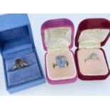 THREE BOXED GOLD RINGS comprising 9ct gold smoky quartz ring, 9ct gold believed aquamarine dress