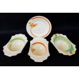 FOUR ITEMS OF CLARICE CLIFF 'BIZARRE' comprising three breakfast bowls with Art Deco handles and a