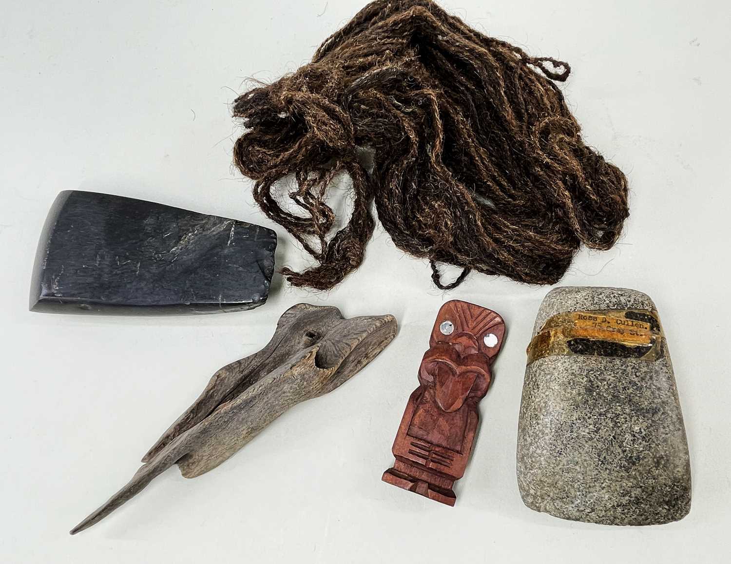 GROUP OF PACIFIC ARTEFACTS, including two stone adze blades, one basalt (possibly Maori) 12.5cm, one