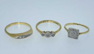 THREE DIAMOND RINGS comprising 18ct gold five stone ring, 18ct gold three stone illusion set ring,