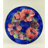 MOORCROFT POTTERY PLAQUE, painted with anemone pattern in red and blue, impressed marks, 30.6cms