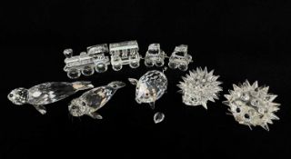 SWAROVSKI ANIMALS & TRAIN, comprising 2 hedgehogs, pig (ear loose), 2 seals and the pull-along toy