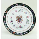 CHINESE ARMORIAL PORCELAIN DISH, painted in the 18th Century style with central full achievement,