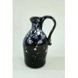 SMALL NAILSEA GLASS JUG, c.1800, of bottle form with rounded shoulders and applied scroll handle,