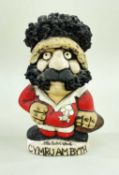 JOHN HUGHES CERAMIC GROGG of a Welsh rugby player possibly Mervyn Davies, boasting black mutton-chop