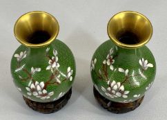 CLOISONNE VASES, A PAIR - decorated with Prunus Blossom on hardwood stands, 15cms tall