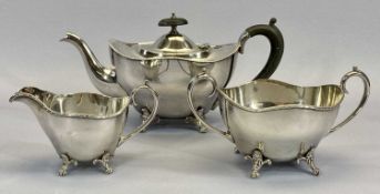 AN ELEGANT 3 PIECE TEA SERVICE on scrolled supports, tea service items, condiments, and a large