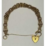 9CT GOLD FANCY GATELINK BRACELET with chase decorated padlock clasp and safety chain, 16cms L