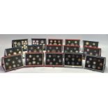 ROYAL MINT UNITED KINGDOM YEAR PROOF COIN SETS X 15 - in blue, red and black leather presentation