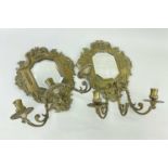 PAIR OF 19TH CENTURY BRASS GIRANDOLES, with beveled glass, triple scrolling candleholders, crowned