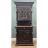 FLEMISH CARVED OAK NARROW CABINET, later leaded and glazed cupboard door between carved uprights