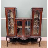 EDWARDIAN MAHOGANY CHINA CABINET, three sections, four doors, bow-front and carved, 122 wide x