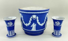 THREE ITEMS WEDGWOOD BLUE JASPERWARE, comprising a cache pot, 20cms high, and a pair or flaring