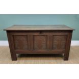 19TH CENTURY OAK COFFER / BLANKET CHEST, having a three panelled front with architectural carving