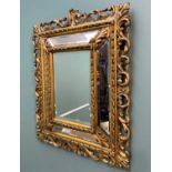 ANTIQUE GILTWOOD FIVE-PANE FURNISHING MIRROR, each section with bevelled glass, the openwork frame