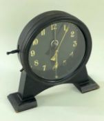EARLY 20TH CENTURY GRAVITY CLOCK, in the Arts & Crafts style, on ebonised arched supprt, keyless