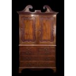 19TH CENTURY MAHOGANY LINEN PRESS, pierced swan neck pediment with central applied oval patera
