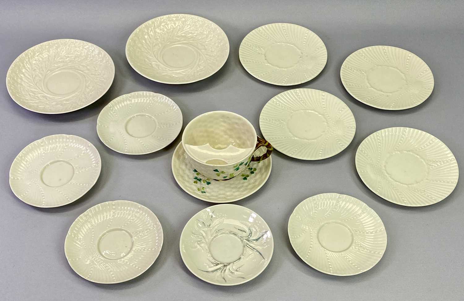 BELLEEK IRISH PORCELAIN, 13 PIECES - to include a Shamrock decorated moustache cup and saucer and