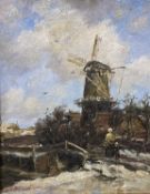 INDISTINCTLY SIGNED oil on board - bonneted lady and child walking over a bridge towards a windmill,