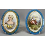 SEVRES STYLE OVAL PORCELAIN PLAQUES (2) - having blue outer borders with gilt reeds and central