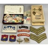 WWII ALUMINIUM CIGARETTE CASE, military insignia and regimental fabric and metal badges with a