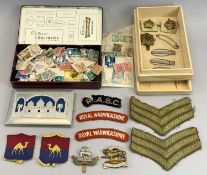 WWII ALUMINIUM CIGARETTE CASE, military insignia and regimental fabric and metal badges with a