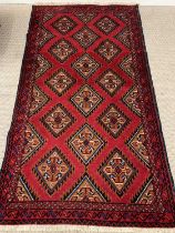 EASTERN STYLE WOOLLEN RUG, red ground with multiple diamond pattern, 182 x 100cms