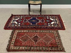 EASTERN RUGS, both red ground, 80 x 126cms and 97 x 191cms together with a VINTAGE UPHOLSTERED