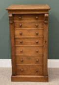 CIRCA 1900 OAK WELLINGTON CHEST, seven drawers with turned wooden knobs on a plinth base, 119cms