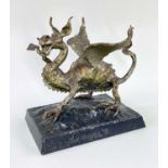 TOM HUGHES patinated metal alloy sculpture - rampant dragon with one leg raised on a steel square