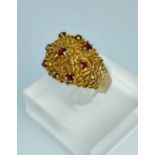 YELLOW GOLD GARNET SET TEXTURED RING, ring size R, 7.2gms, in ring box Provenance: private