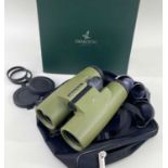 A CASED PAIR SWAROVSKI OPTIK BINOCULARS model SLC 7 x 42, with case, box and sleeve Comments: