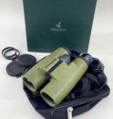 A CASED PAIR SWAROVSKI OPTIK BINOCULARS model SLC 7 x 42, with case, box and sleeve Comments: