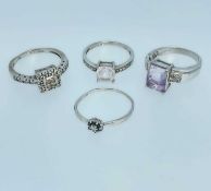 FOUR 9CT WHITE GOLD DRESS RINGS set with various semi-precious gems, 12.0gms gross Provenance: