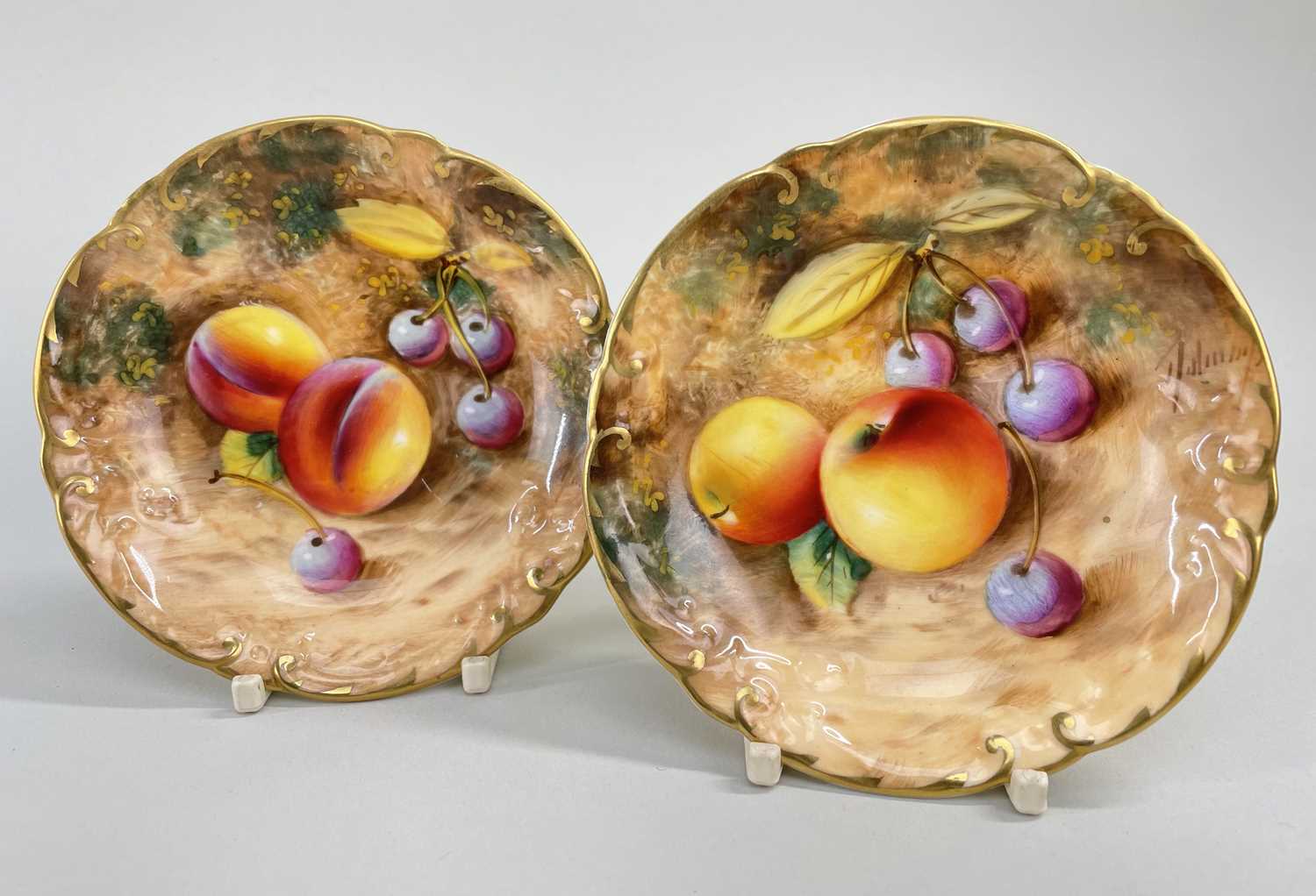 PAIR OF ROYAL WORCESTER FALLEN FRUIT BONE CHINA PIN DISHES, signed 'Roberts', hand-painted with