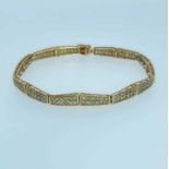 9CT GOLD PANEL BRACELET set with green gems, likely Alexandrites, 20cms long, 9.4gms, in