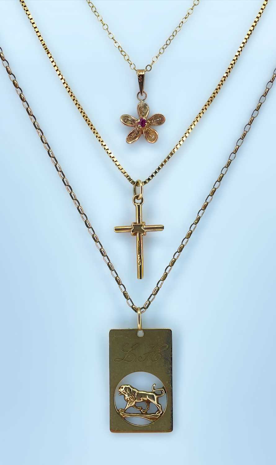 9CT GOLD JEWELLERY comprising 9ct gold cross pendant on chain, 9ct gold flower pendant on chain