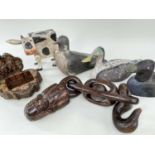 GROUP OF WOODEN FURNISHING CURIOS including three duck decoys, a standing friesian cow, a carved