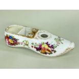 A SPODE PORCELAIN INKWELL IN THE FORM OF A SLIPPER with pointed toe, the cavity divided into two